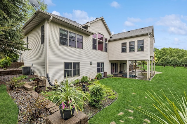 3041 209th Ln NW, Oak Grove, MN 55011 - rear view of house with a patio, cooling unit, and a yard