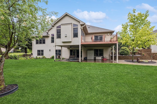 3041 209th Ln NW, Oak Grove, MN 55011 - rear view of house featuring a lawn, a patio, a shingled roof, and a ceiling fan
