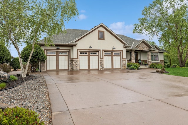3041 209th Ln NW, Oak Grove, MN 55011 - view of front facade featuring stucco siding, stone siding, concrete driveway, an attached garage, and roof with shingles