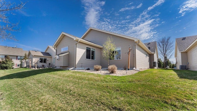 view of home's exterior with a yard and cooling unit