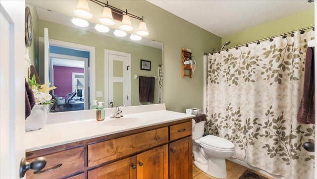 bathroom featuring vanity, tile patterned flooring, toilet, and a shower with shower curtain