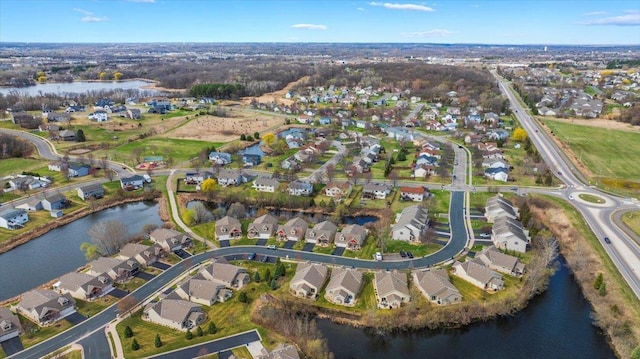 bird's eye view with a water view and a residential view