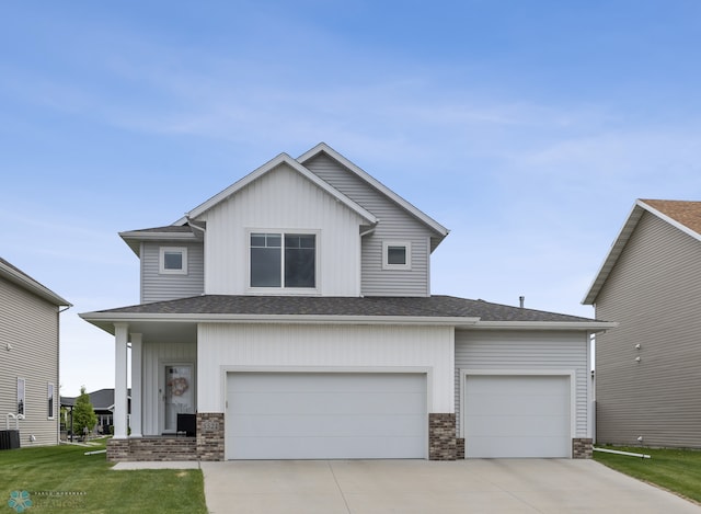 5521 8th St W, West Fargo, ND 58078 - view of front of property with concrete driveway, board and batten siding, and roof with shingles