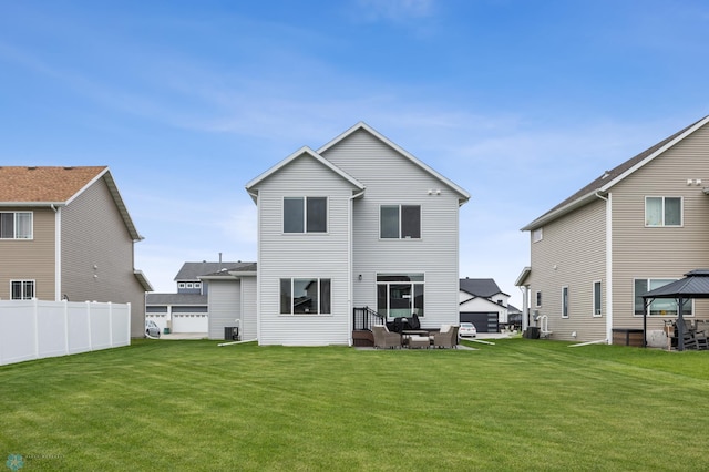 5521 8th St W, West Fargo, ND 58078 - rear view of house featuring a gazebo, central AC, and an outdoor living space