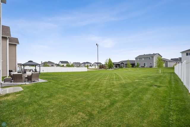 5521 8th St W, West Fargo, ND 58078 - view of yard with a residential view, outdoor lounge area, a gazebo, and a patio area