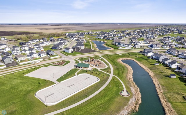 5521 8th St W, West Fargo, ND 58078 - aerial view of property and surrounding area featuring a nearby body of water and nearby suburban area