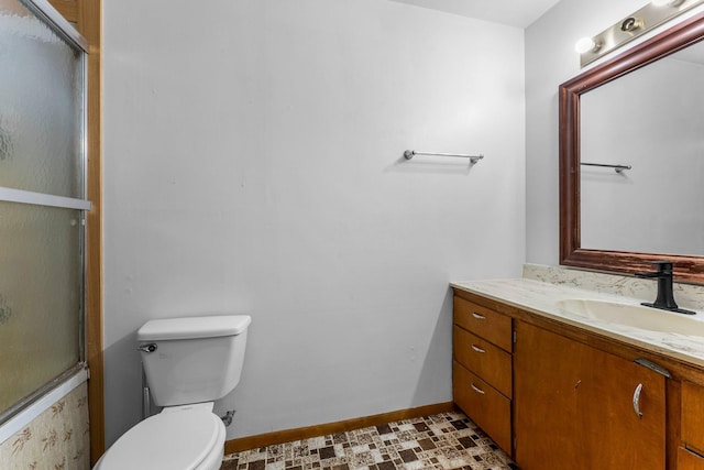 full bathroom with baseboards, an enclosed shower, toilet, and vanity