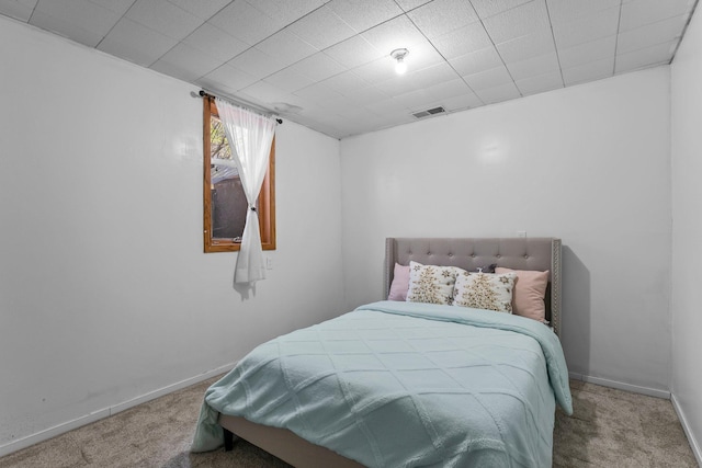 carpeted bedroom with baseboards and visible vents