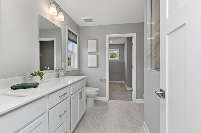 full bathroom featuring a sink, toilet, marble finish floor, baseboards, and visible vents