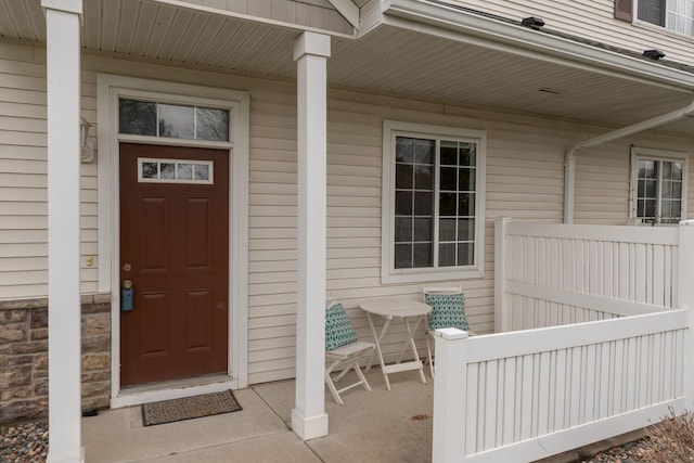 doorway to property featuring a porch