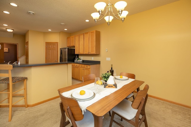 dining space featuring recessed lighting, a chandelier, light colored carpet, and baseboards