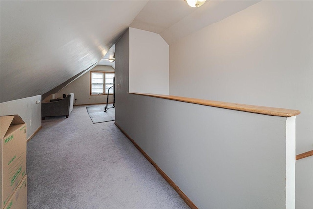 bonus room featuring baseboards, carpet, and lofted ceiling