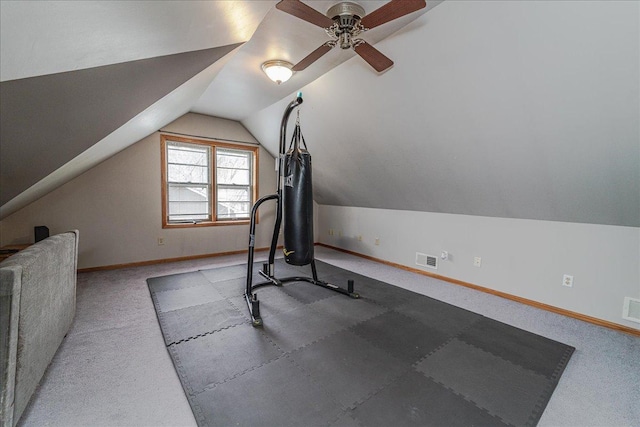 exercise area with visible vents, a ceiling fan, baseboards, and lofted ceiling