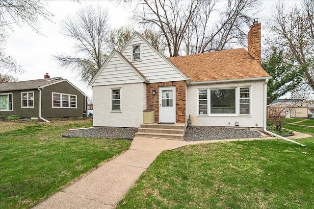 bungalow-style house featuring a chimney and a front lawn