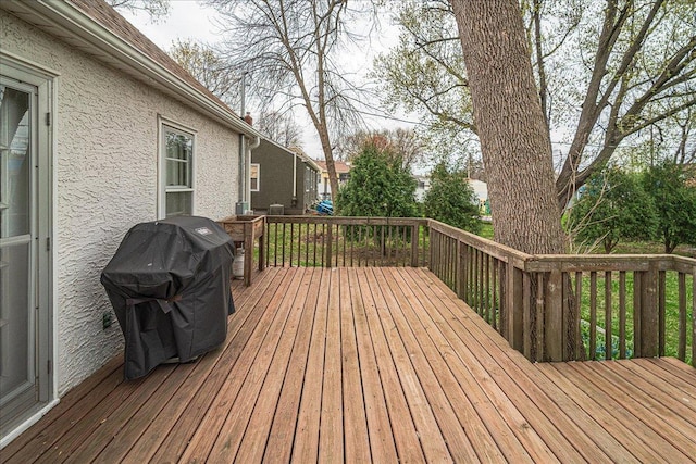 wooden deck featuring area for grilling