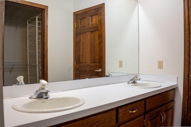 bathroom with a sink and double vanity