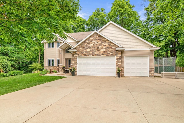 5450 Raven Point Rd, Prior Lake, MN 55372 - craftsman-style home with stone siding, concrete driveway, and an attached garage