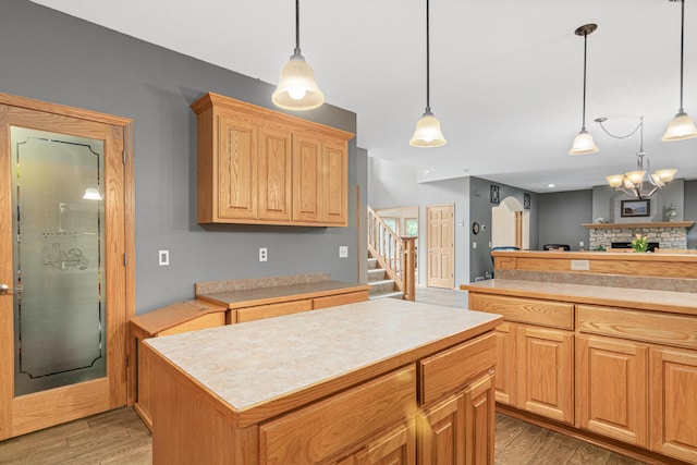 5450 Raven Point Rd, Prior Lake, MN 55372 - kitchen featuring light countertops, light wood-style flooring, and pendant lighting