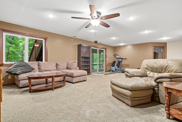 5450 Raven Point Rd, Prior Lake, MN 55372 - carpeted living area featuring a ceiling fan, a textured ceiling, and recessed lighting