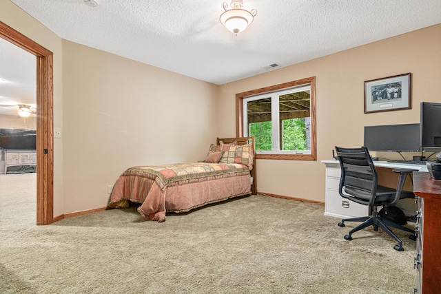 5450 Raven Point Rd, Prior Lake, MN 55372 - carpeted bedroom featuring an office area, baseboards, and a textured ceiling