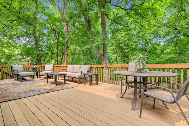 5450 Raven Point Rd, Prior Lake, MN 55372 - wooden terrace featuring outdoor dining space, outdoor lounge area, and view of scattered trees