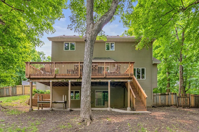 5450 Raven Point Rd, Prior Lake, MN 55372 - rear view of house featuring a deck, a fenced backyard, and stairway