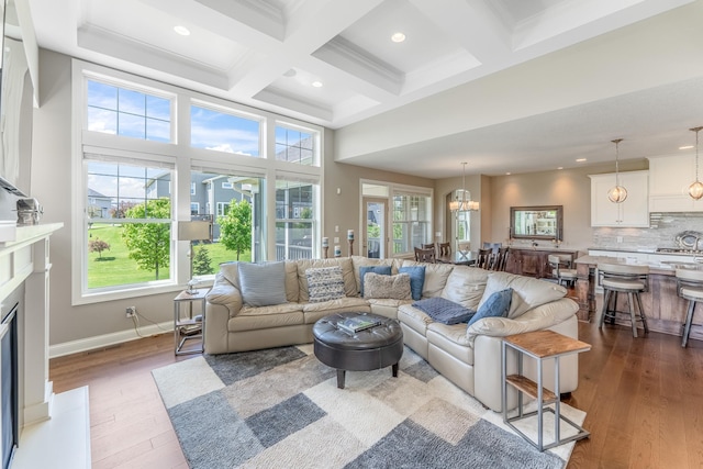 11328 Blazingstar Ln, Lake Elmo, MN 55042 - living room with beamed ceiling, coffered ceiling, wood finished floors, recessed lighting, and a fireplace
