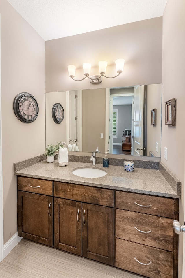 11328 Blazingstar Ln, Lake Elmo, MN 55042 - bathroom with vanity and baseboards