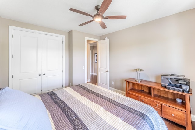11328 Blazingstar Ln, Lake Elmo, MN 55042 - bedroom with baseboards, a closet, wood finished floors, ceiling fan, and an office area