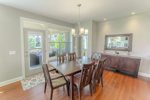 11328 Blazingstar Ln, Lake Elmo, MN 55042 - dining room with a chandelier, light wood-style floors, baseboards, and recessed lighting