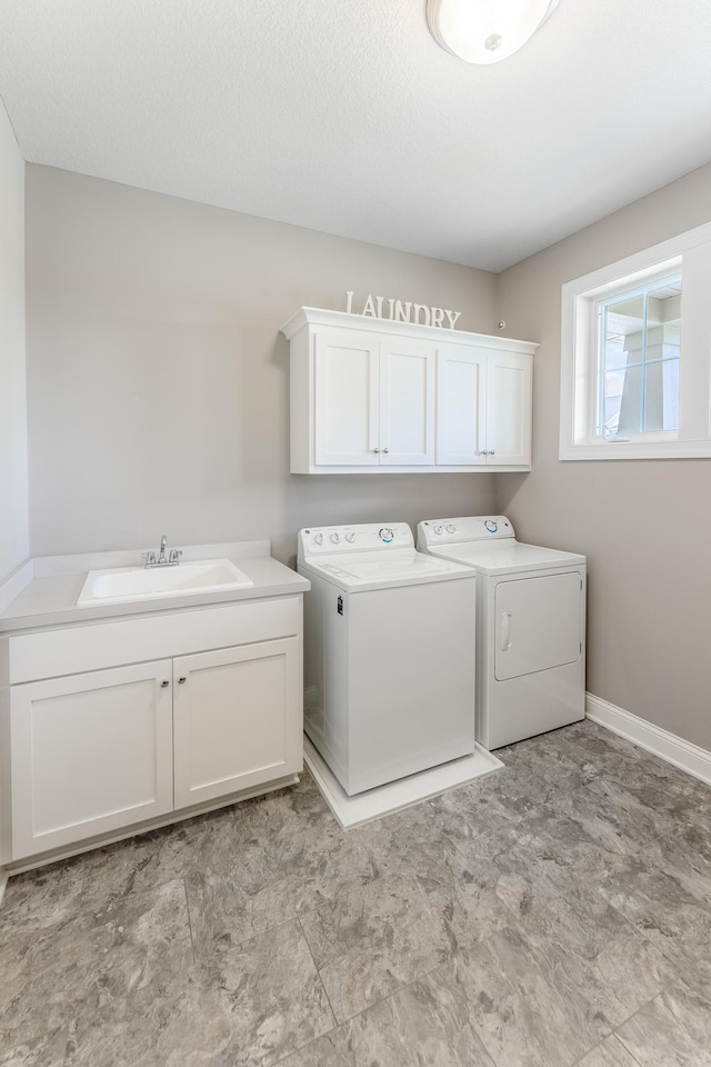 11328 Blazingstar Ln, Lake Elmo, MN 55042 - washroom featuring washing machine and clothes dryer, cabinet space, and baseboards