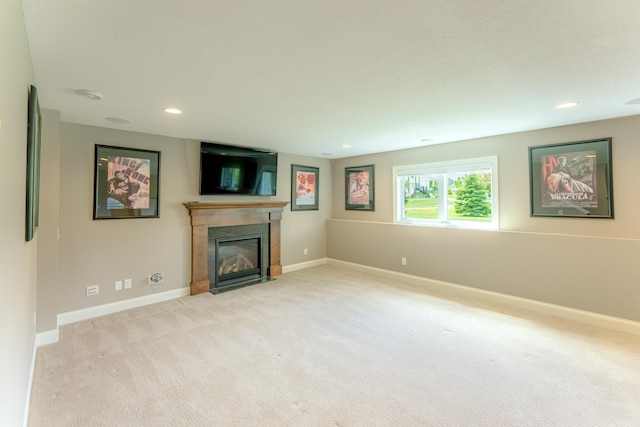 11328 Blazingstar Ln, Lake Elmo, MN 55042 - unfurnished living room with a fireplace with flush hearth, light colored carpet, baseboards, and recessed lighting
