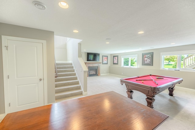 11328 Blazingstar Ln, Lake Elmo, MN 55042 - recreation room featuring light carpet, baseboards, recessed lighting, pool table, and a glass covered fireplace