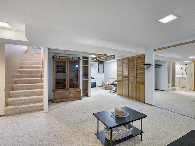 living room with electric panel, carpet, and stairway