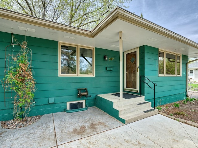 property entrance with a patio area