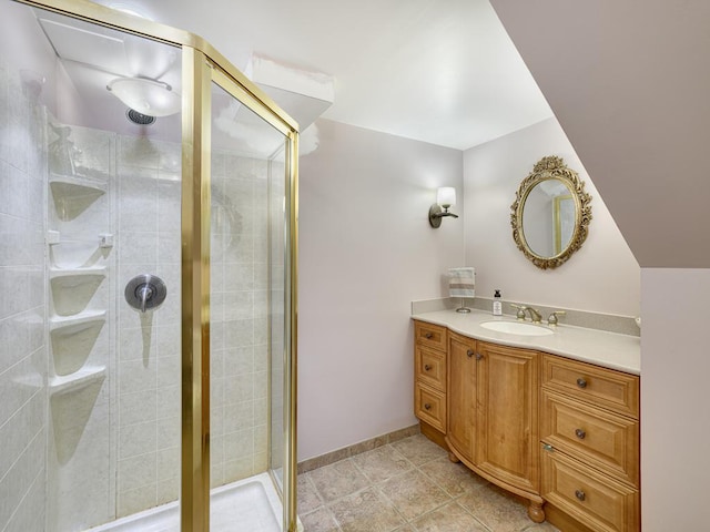 bathroom featuring a shower stall and vanity