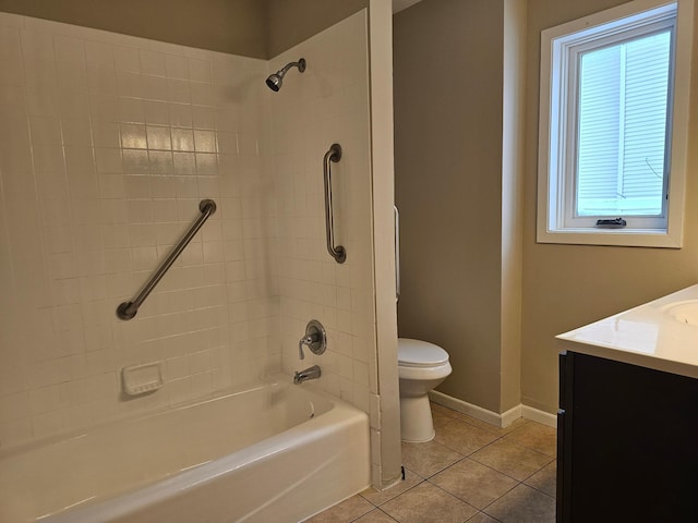 full bathroom with tile patterned floors, vanity, tub / shower combination, baseboards, and toilet