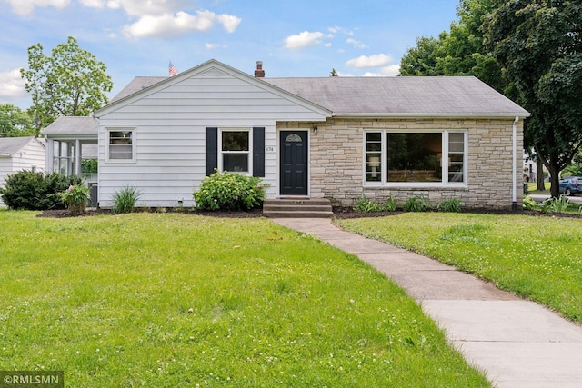 674 Wheelock Pkwy W, Saint Paul, MN 55117 - view of front facade featuring a front yard, stone siding, and roof with shingles