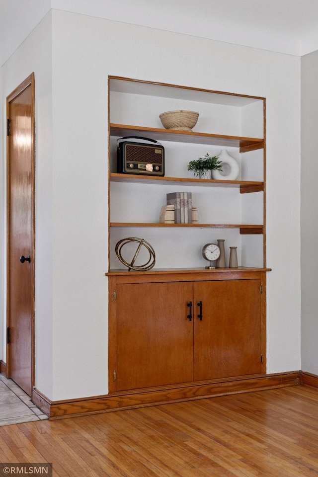 674 Wheelock Pkwy W, Saint Paul, MN 55117 - detailed view of wood finished floors and baseboards