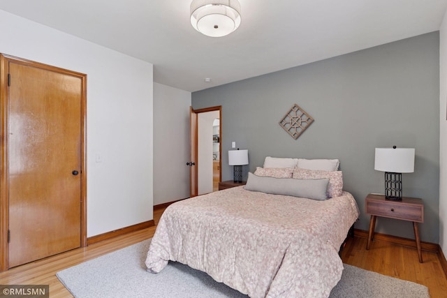 674 Wheelock Pkwy W, Saint Paul, MN 55117 - bedroom with light wood-style floors and baseboards