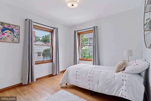674 Wheelock Pkwy W, Saint Paul, MN 55117 - bedroom with wood finished floors and baseboards