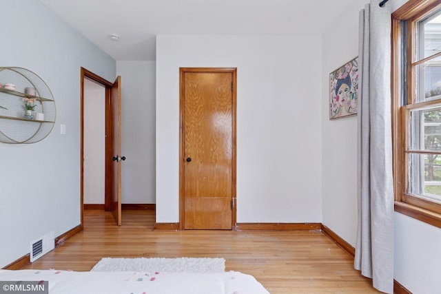674 Wheelock Pkwy W, Saint Paul, MN 55117 - bedroom featuring light wood-type flooring and baseboards