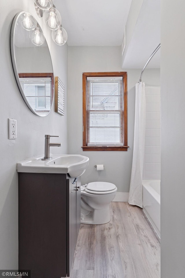 674 Wheelock Pkwy W, Saint Paul, MN 55117 - full bath featuring vanity, wood finished floors, and shower / bath combination with curtain