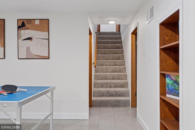 674 Wheelock Pkwy W, Saint Paul, MN 55117 - staircase featuring baseboards and tile patterned floors