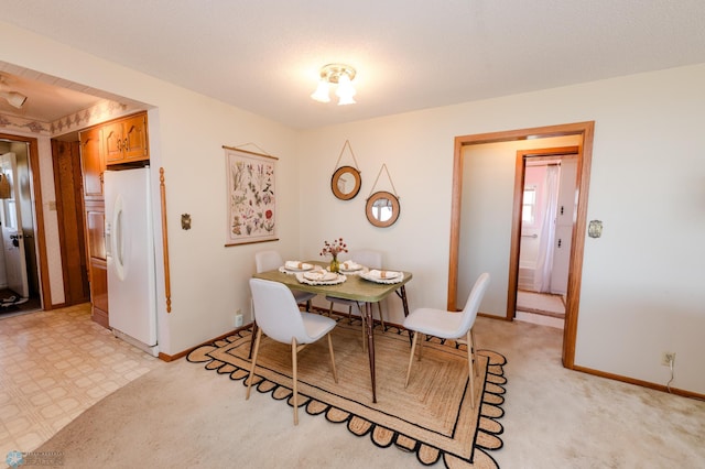 dining space with baseboards