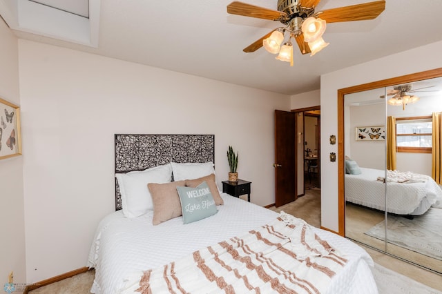 bedroom featuring a ceiling fan, baseboards, carpet, and a closet