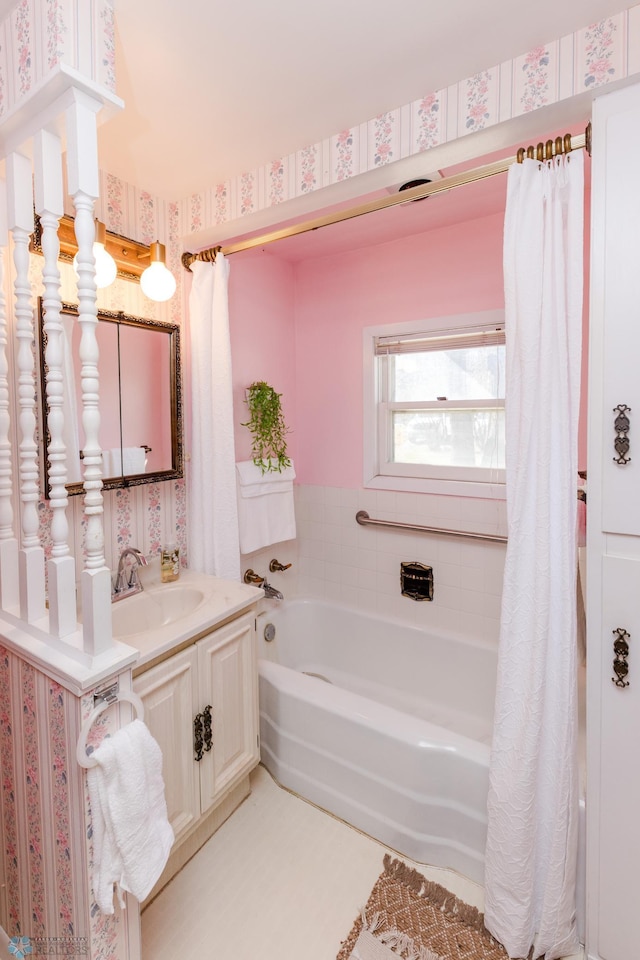 full bathroom with vanity, a shower with shower curtain, wallpapered walls, and a bathing tub