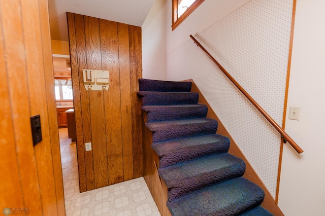 staircase with tile patterned floors