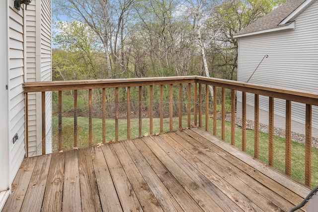 wooden terrace with a yard
