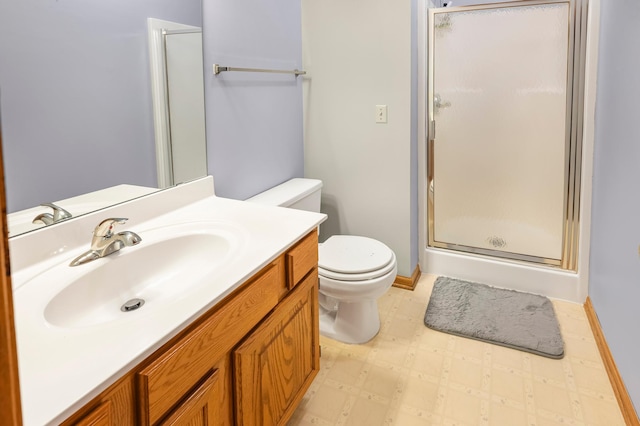 full bathroom featuring toilet, a stall shower, tile patterned floors, baseboards, and vanity